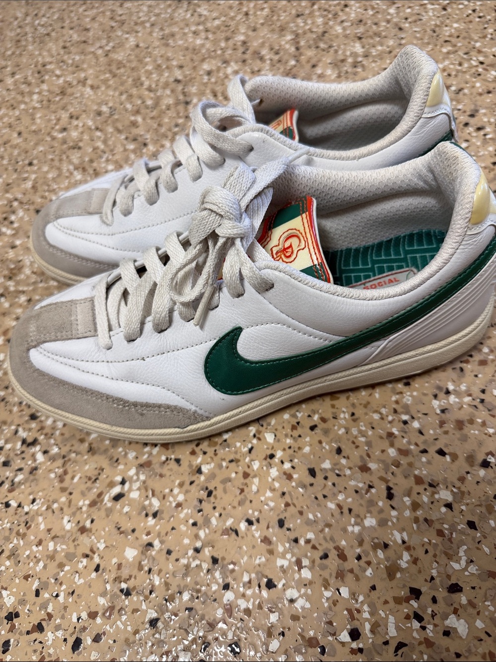 Nike Women’s White Sneakers with Green Swoosh Size 7.5